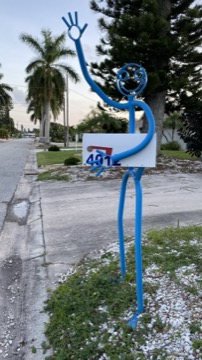 Whimsical waving mailbox in the neighborhood